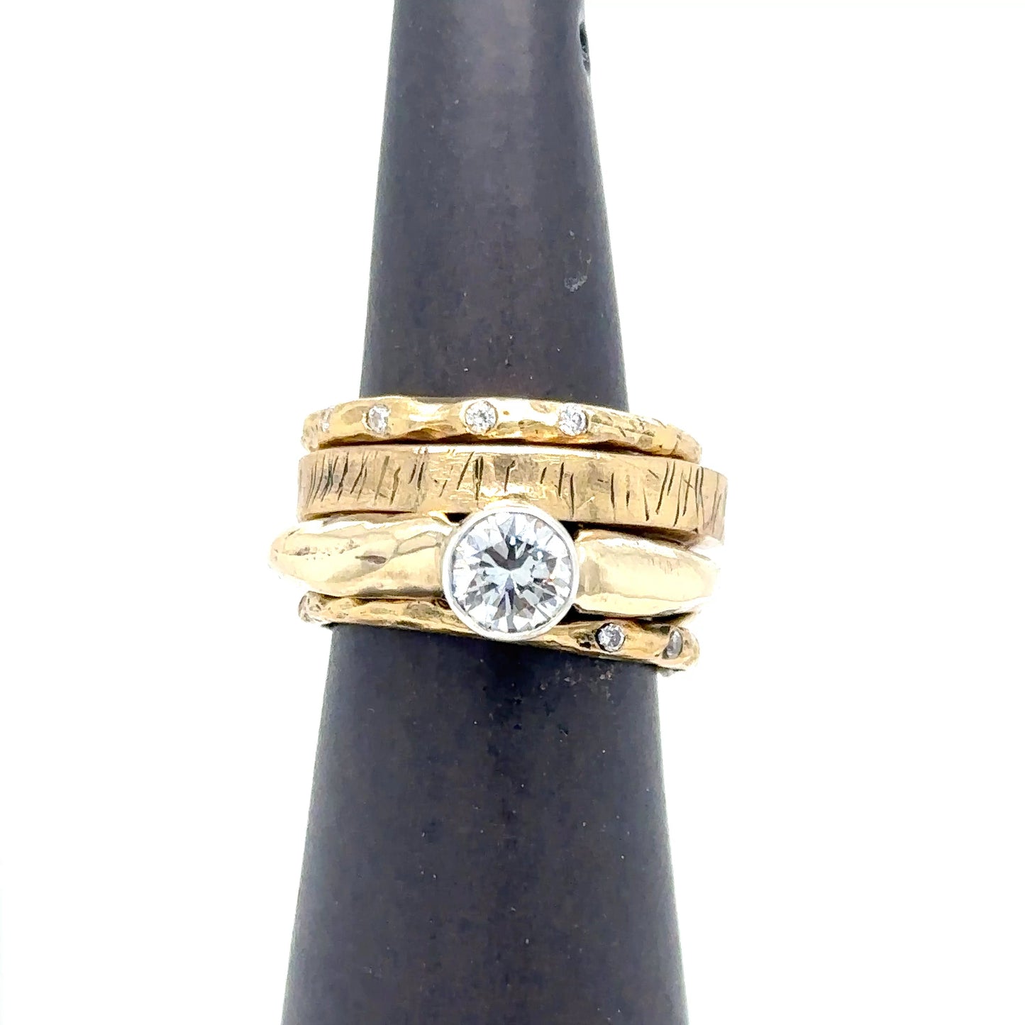 18kt Gold Rings in Luxe Collection on Ring Stand