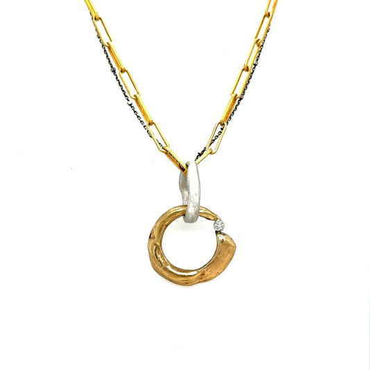 A talisman necklace of transformation, Ascendant embodies the eternal dance between sun and moon, marking the precise moment when change becomes destiny. Two celestial forces intertwine in precious metal, crowned with a radiant 2.5ct white diamond that captures the pure brilliance of personal awakening.