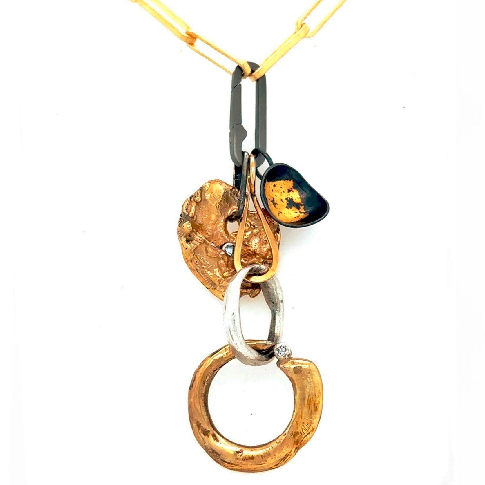 Various Talisman Pendants featuring Ascendant, Love, and Truth on the Gold Link Chain