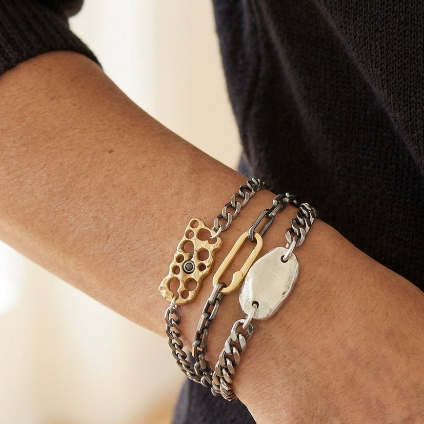The Keep Bracelet from the Hive Collection on a Model layered with the Link & Hold Bracelets.