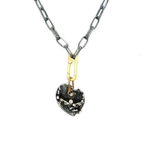 This sophisticated chain is made of solid sterling silver and the weight of it is luxurious. It has a brushed oxidized silver finish. Links are 3/8" in size. The closure is our Gold Paper Clip Connector which is designed to easily attach your Talisman collection. Pendant is not included.