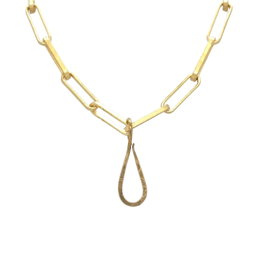 A lux chain for gold lovers! The even links of 18 kt gold plate brighten all skin tones and the oxidized silver paperclip connector adds that edge. Ideal as a single chain, but we love it layered with Talisman! Shown with Brass Tear Drop Connector.