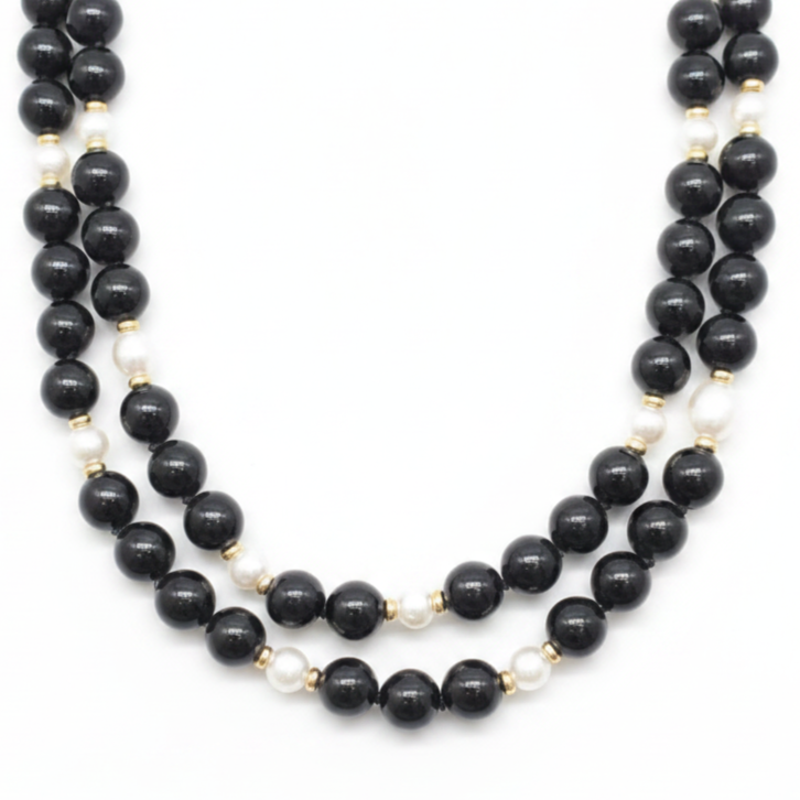 Close up of the Tiffany & Co. Black Onyx, Pearl and Gold Beaded Necklace in the Chikahisa Ancestor Collection.