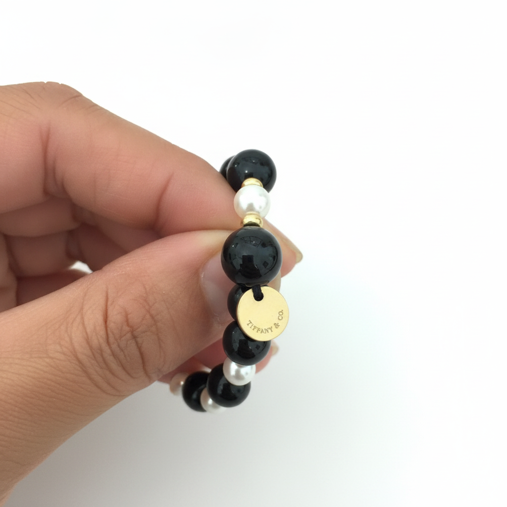 Tag on the Tiffany & Co. Black Onyx, Pearl and Gold Beaded Necklace in the Chikahisa Ancestor Collection.
