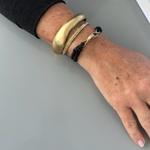 Skipping Stones Simple Bracelet in Bronze with Black Diamonds layered with the Wide Divine Cuff and Interwoven Bracelet in Bronze