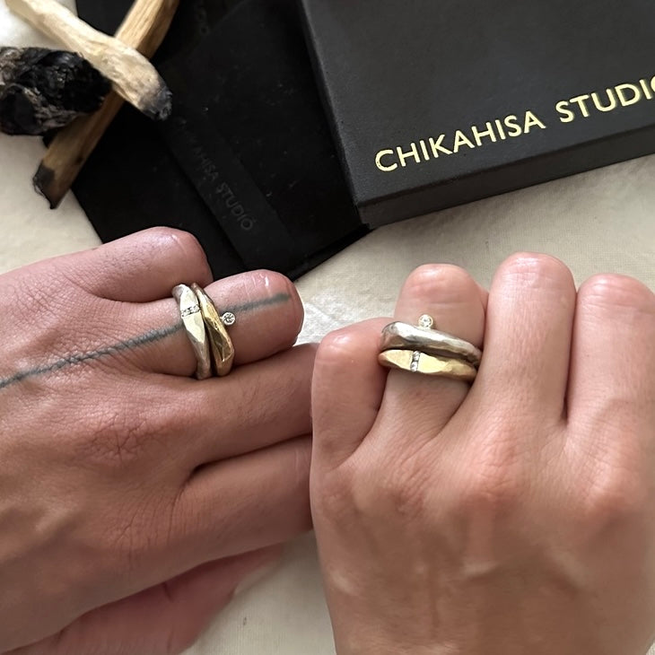 The Channel Ring is designed to channel your desires and aspirations, empowering you to manifest your dreams with unwavering determination. Handcrafted with the ancient lost wax casting technique, the 2 to 4mm organic band is sterling silver and features two brilliant 2mm white diamonds symbolizing harmony and balance.