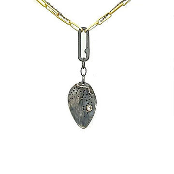 The Discreet Talisman Necklace holds a special place for you to carry your deepest desires.
