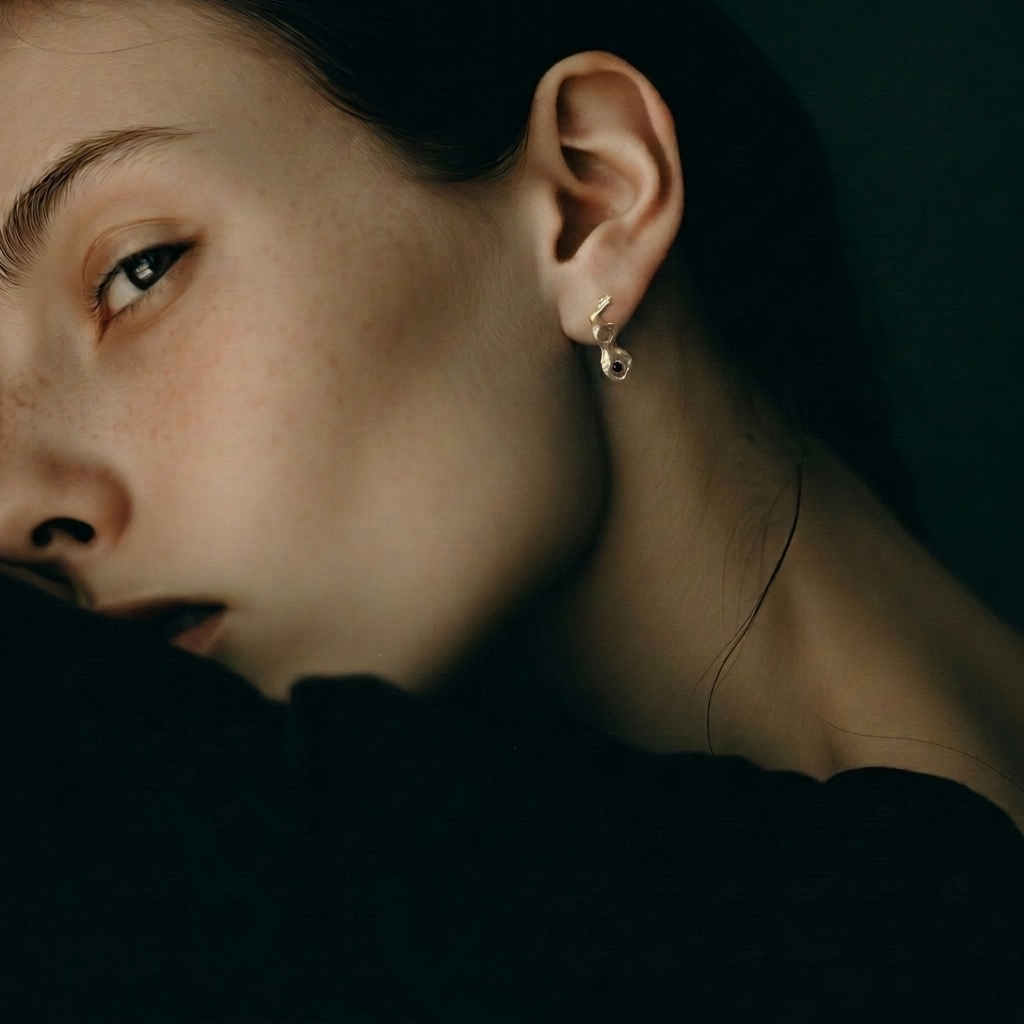The Cell Stud Earrings from the Hive Collection on a Model