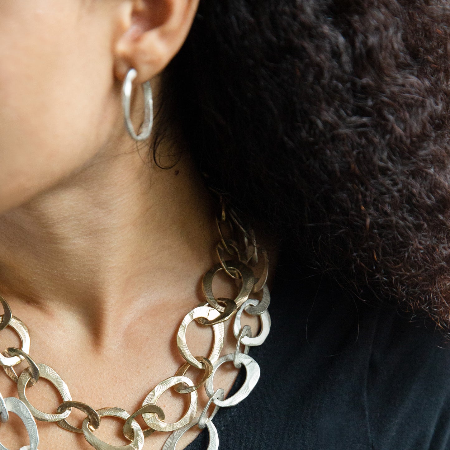 Close up of Stonehenge Hoop Earrings in Silver on Model