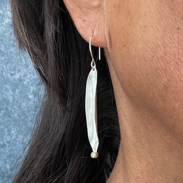 Strength Talisman Earrings on a person