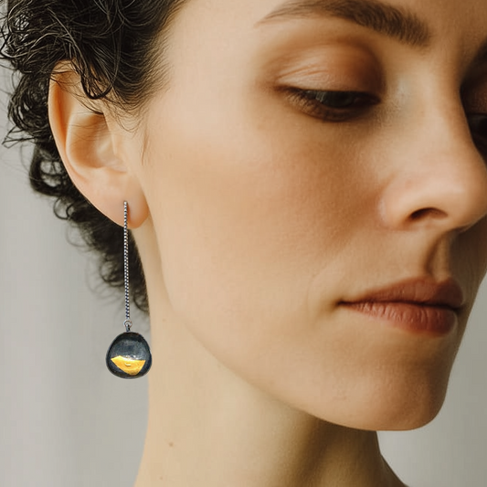 Close up of model wearing the Truth Talisman Earrings