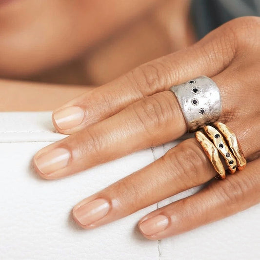 The Five Elements Ring in Silver and Connection Stacking Set in Bronze on Model