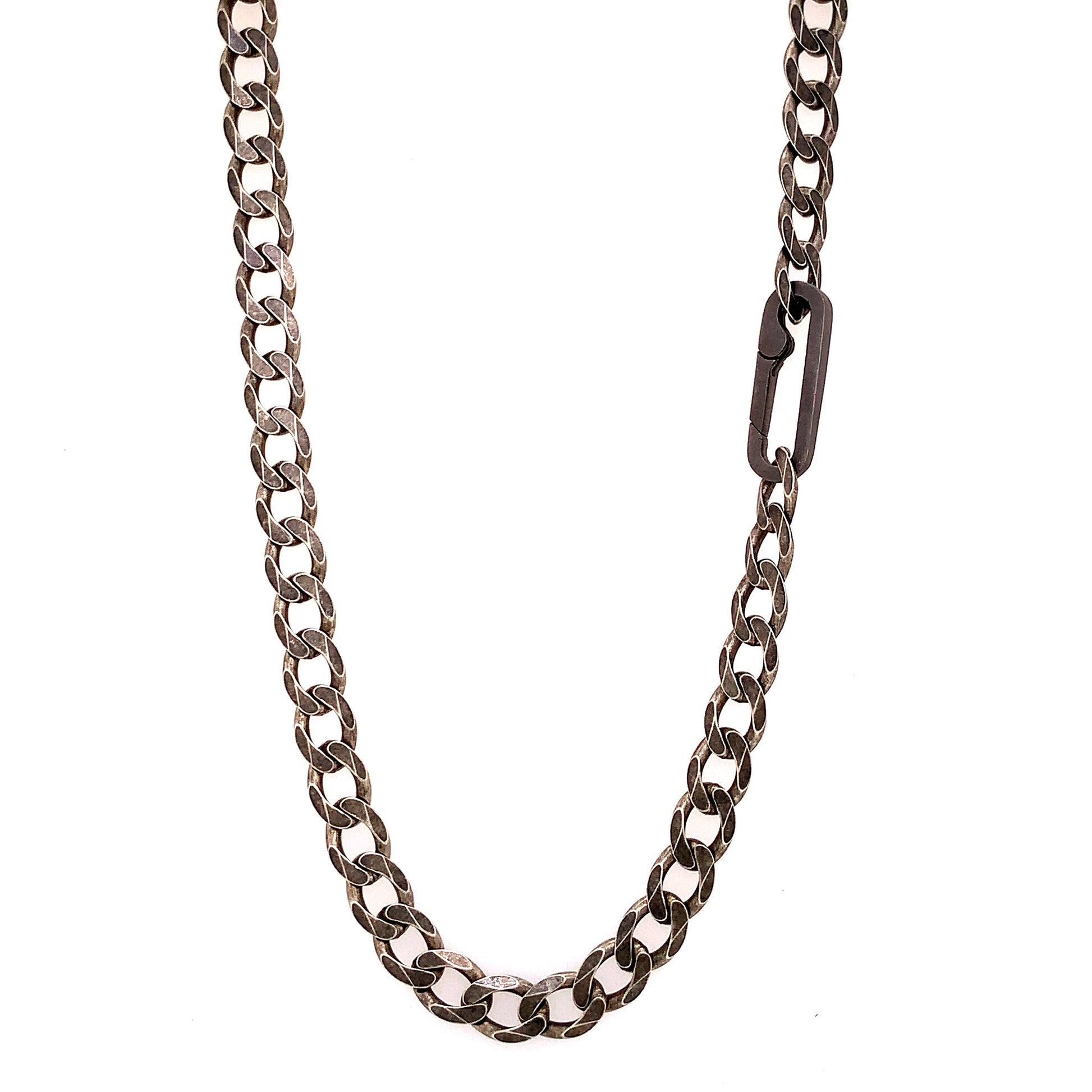 The large links, weight and texture of this flat curb chain have it all. This is the perfect chain to layer with other chains, wear solo, or use the Paperclip Connector & add a few of your favorite Talisman.