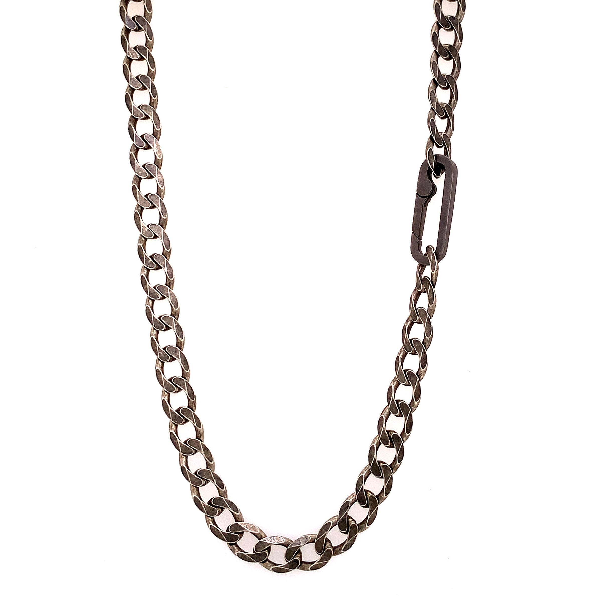 The large links, weight and texture of this flat curb chain have it all. This is the perfect chain to layer with other chains, wear solo, or use the Paperclip Connector & add a few of your favorite Talisman.