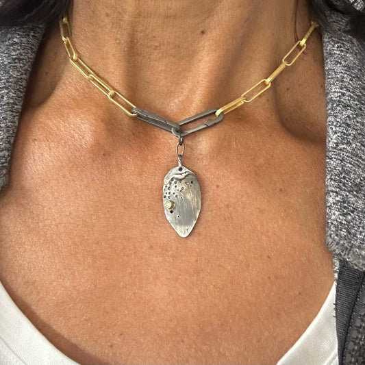 Crafted with precision and care, the gold link chain features double paper clip clasps, adding a subtle yet distinctive edge. But what truly sets this piece apart is the enchanting Desire Talisman it carries. Unveil the magic of keeping your most intimate wishes close to your heart—a hidden compartment within the talisman lets you carry your secret desires discreetly and stylishly.