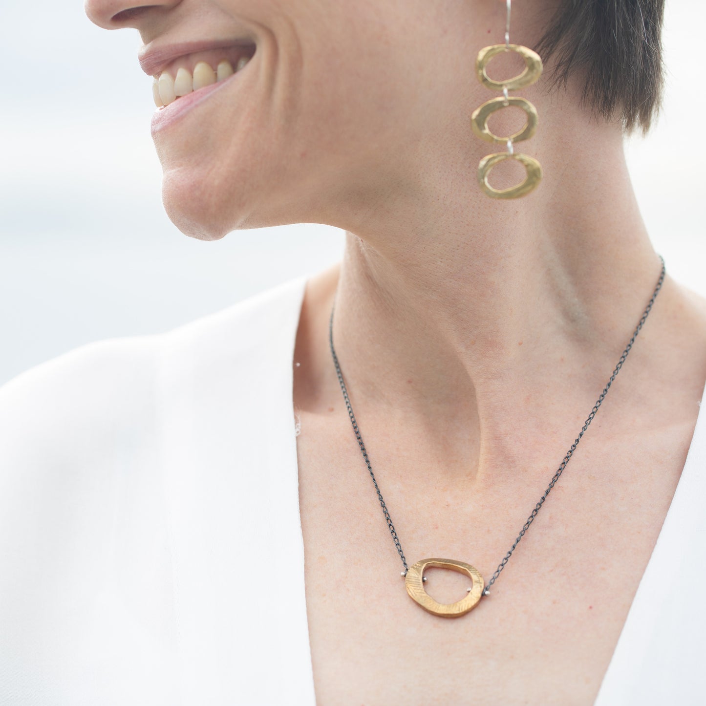 The Bronze Skipping Stones Simple Necklace on Model