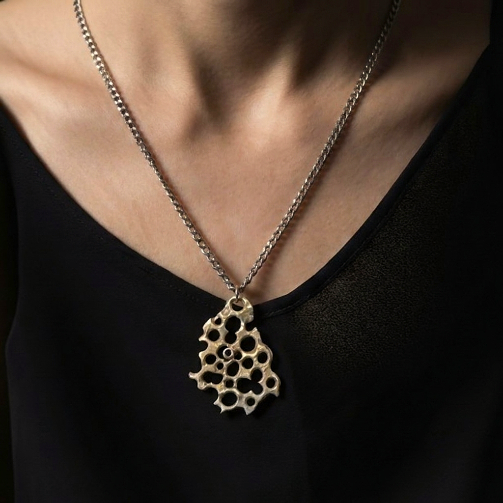 The Colony Pendant Necklace from the Hive Collection on a model
