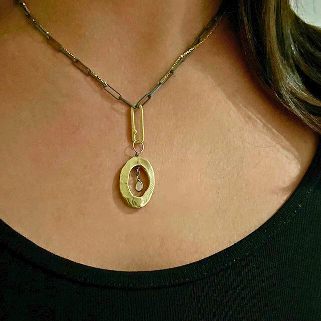 The Peace Talisman Necklace on a person
