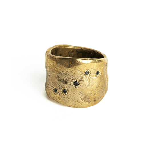 The Five Elements Ring is a stunning tribute to the five elements of nature - water, wood, fire, earth and metal. The unique and meaningful design features five black diamonds, representing each element and its significance in Japanese culture. Handcrafted with a wide band that is deceptively comfortable, this ring is designed to be worn every day as a reminder to stay present and connected to the planet.