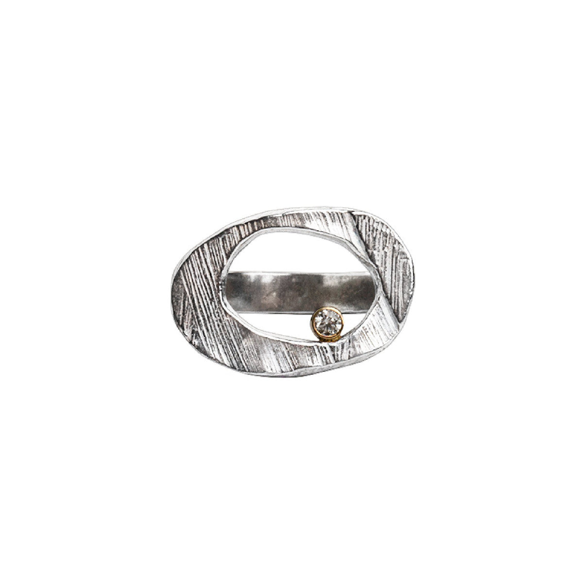 The Ovum Ring is a timeless and symbolic piece perfect for anyone looking to manifest a new chapter in their life. Ovals have been used to represent rebirth since ancient times, and this ring is no exception. Its sleek design features a perfectly shaped oval with a bezel set white diamond. It's a powerful symbol and a reminder that no matter what happens in life, there is always a chance for renewal and growth.