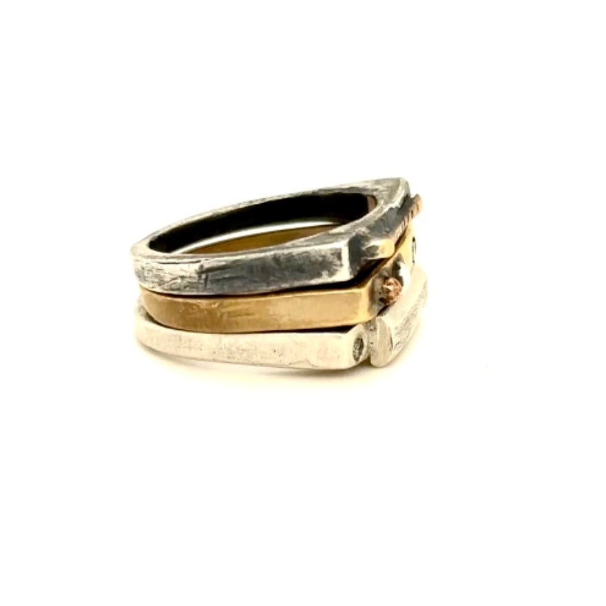 The Trinity Ring Stack is a mix of metals and precious stones and when you stack them together, they create a synergy that reflects the beautiful interplay of body, mind, and spirit.