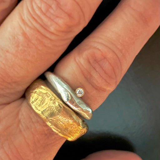 Rebel Ring in Bronze with Odyssey Ring in silver on hand