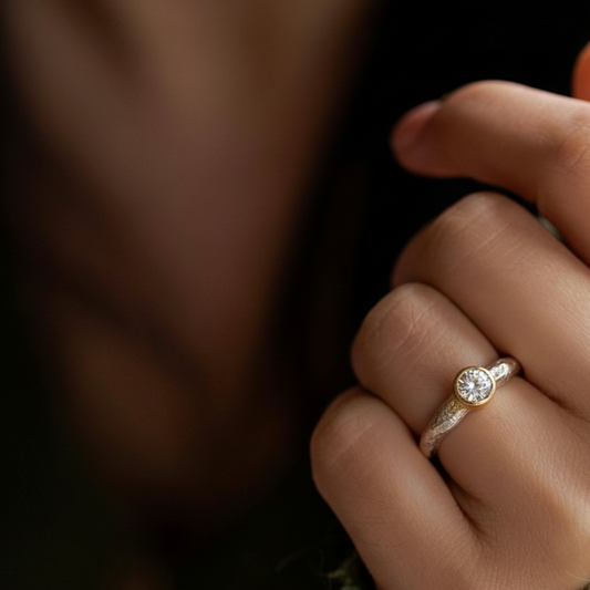 Devotion ring is silver with white diamond on model