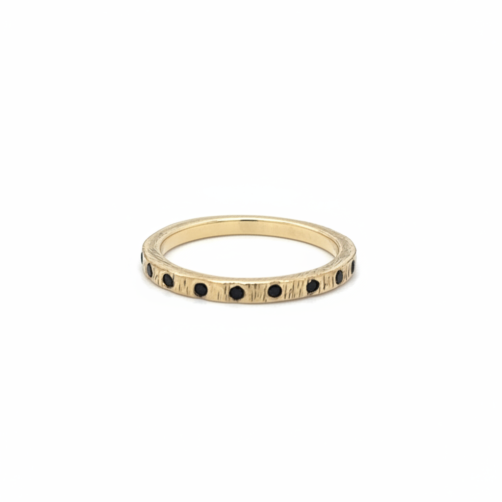 The Ritual Noir Ring glows with black diamonds and bronze texture. A talisman of grounding, strength, and quiet fire.