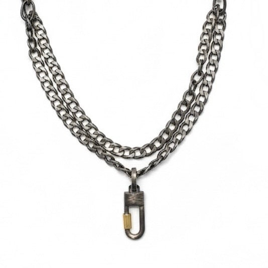We've combined two cool oxidized sterling chains - one is a chunky flat curb & the other a large link oval on this layered necklace. You can add a few Talisman to the Sterling Lock Connector and turn up the volume!