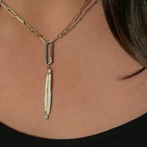 Strength Talisman Necklace on a person