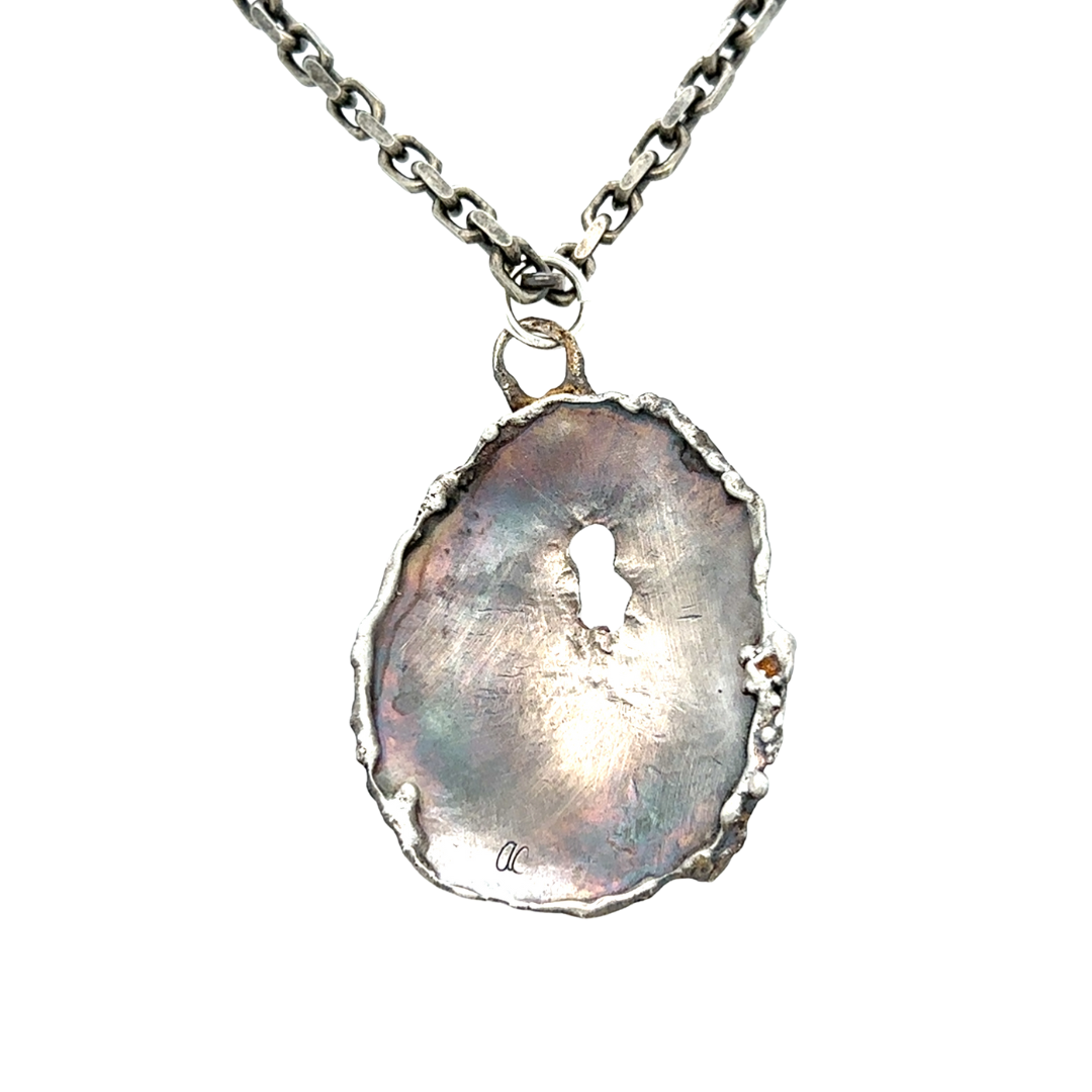 Backside close up of Awaken Talisman Pendant in Silver