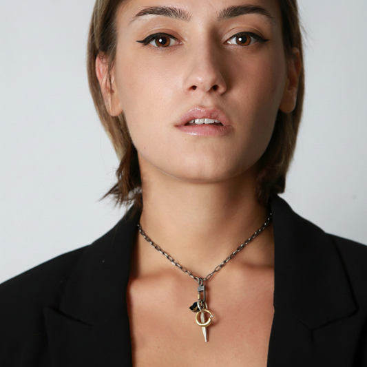 Model wearing a Talisman Combination of Ascendent, Strength, and Truth Pendants on Lock Connector and Oxidized Silver Chain.