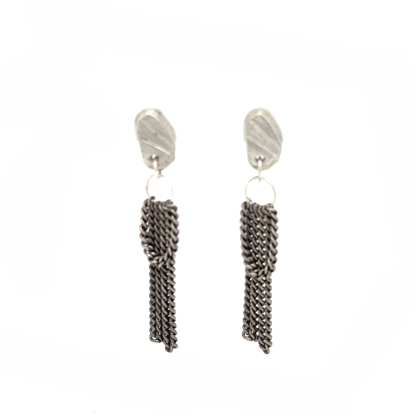 Experience the gentle allure of Whidbey Island's hidden waterfalls with our Cascade Studs. They capture the essence of water's delicate journey from stone to sea, embodying the island's secret, shimmering cascades.
Each stud features a small, intricately textured piece that evokes the rugged beauty of Whidbey's rocky outcrops. The surface mirrors the weathered stones shaped by centuries of flowing water and catches the light much like sunlight playing on rippled water, adding a subtle sparkle.