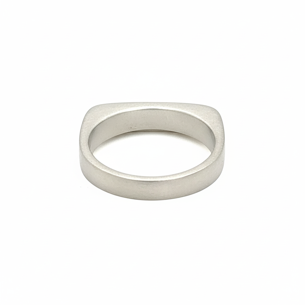 Back view of this sleek, architectural band captures that moment of clarity with its refined silhouette and single black diamond - like the dark center of an eclipse where revelation occurs in shadow.