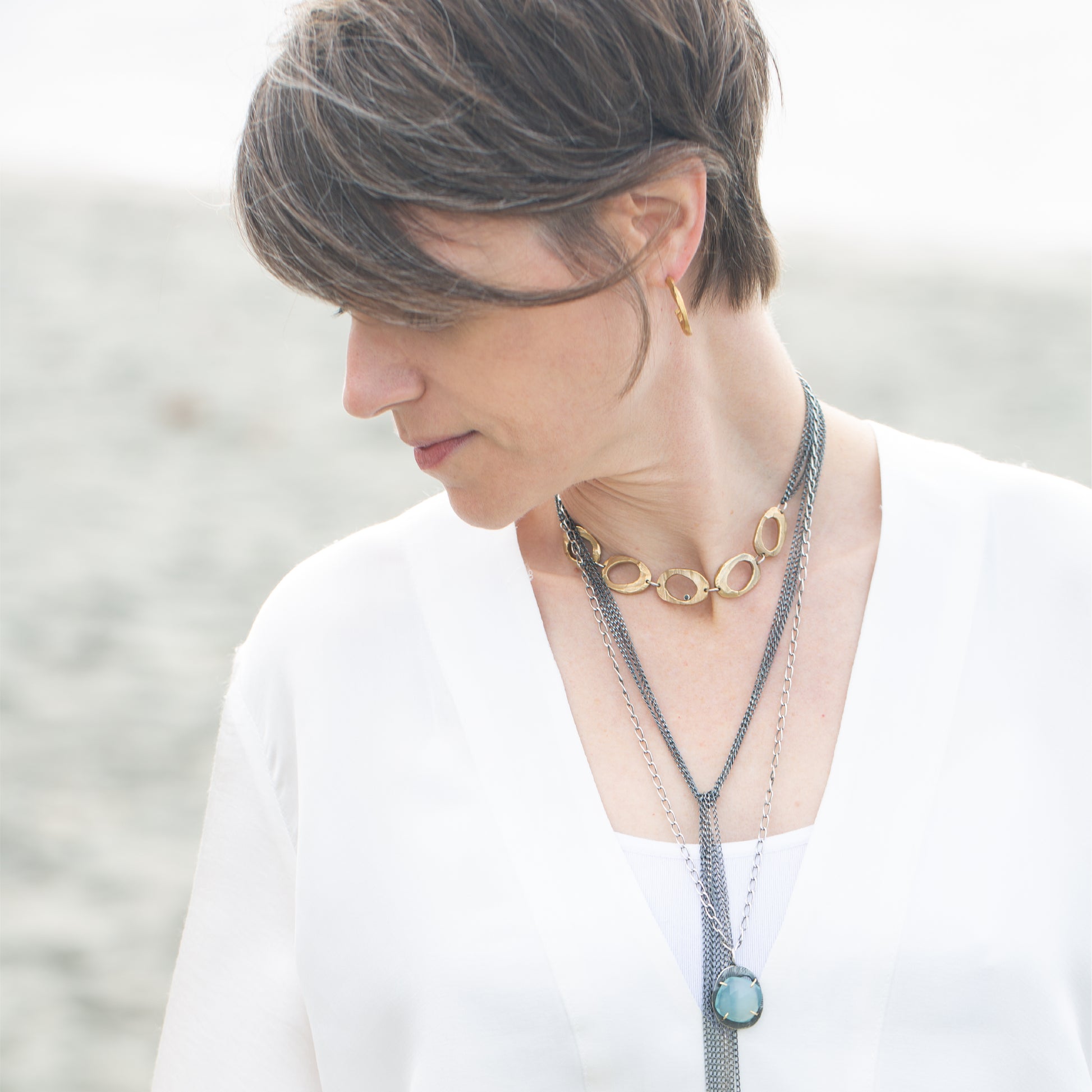 Bronze Small Hoop Earrings on Model with Necklaces