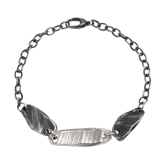 Delicate yet durable, this bracelet features intricately woven strands that symbolize the interconnectedness of life's experiences. The adjustable clasp ensures a perfect fit for any wrist size This exquisite piece has the sophistication of sterling silver and oxidized sterling silver in a harmonious design.