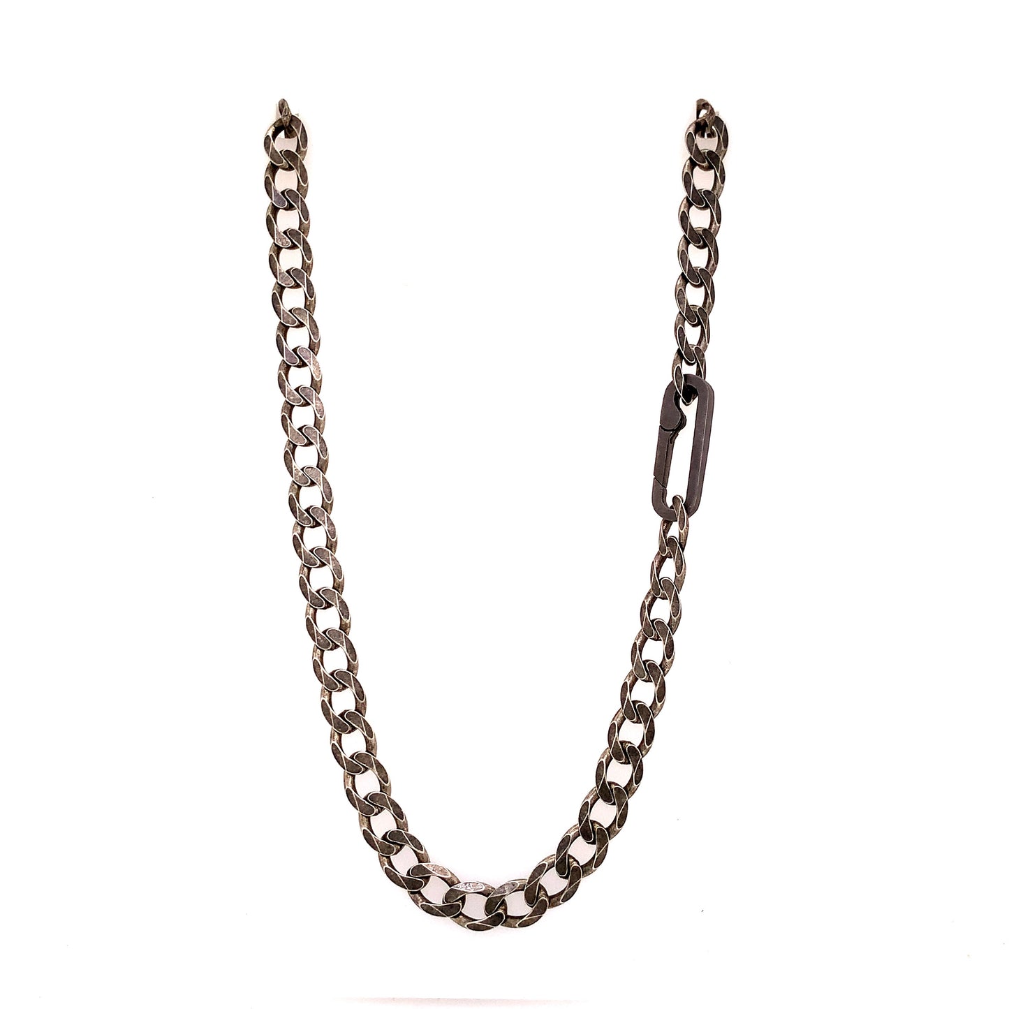 The large links, weight and texture of this flat curb chain have it all. This is the perfect chain to layer with other chains, wear solo, or use the Paperclip Connector & add a few of your favorite Talisman.