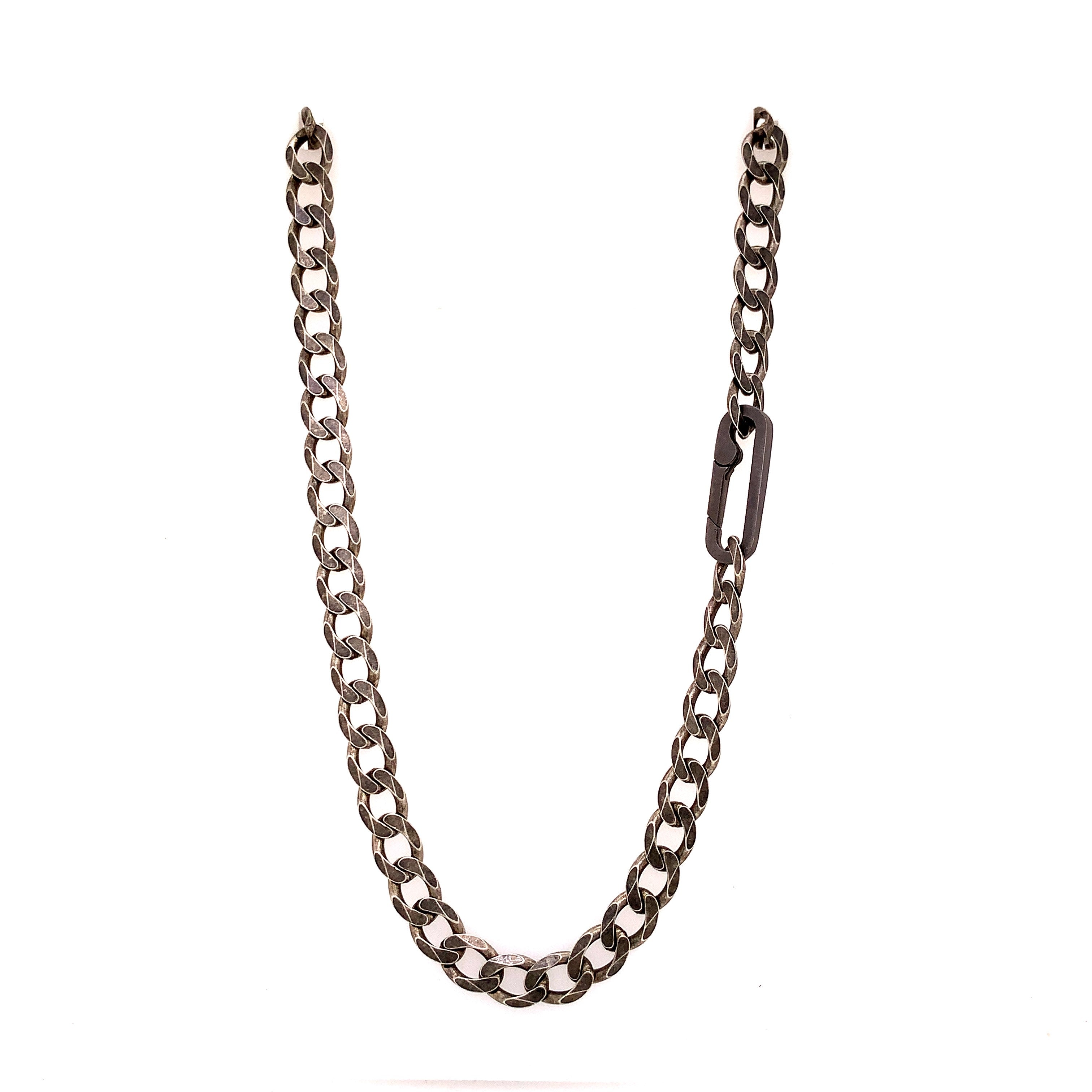 The large links, weight and texture of this flat curb chain have it all. This is the perfect chain to layer with other chains, wear solo, or use the Paperclip Connector & add a few of your favorite Talisman.