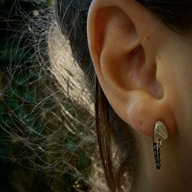 Close up of the Stone Stud with Chain in Silver on a person