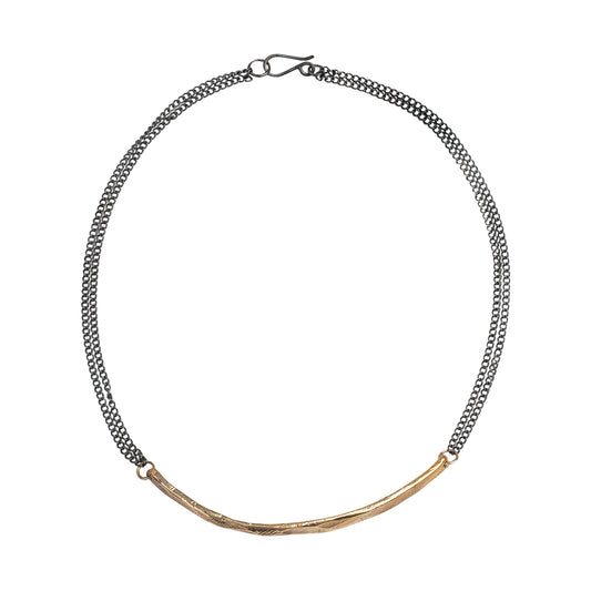 A necklace with a bronze bar component and oxidized sterling silver chain, featuring a hand made S hook clasp.