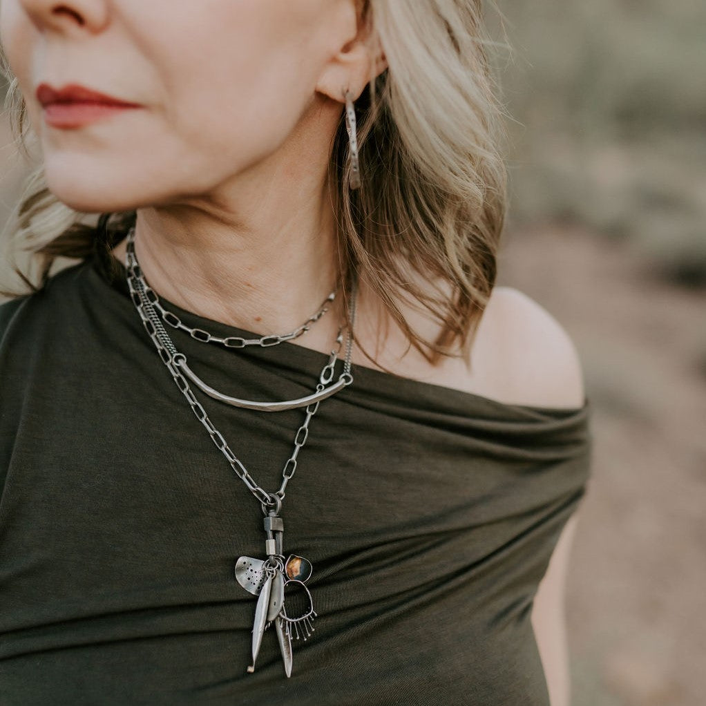 woman wearing a bunch of necklaces
