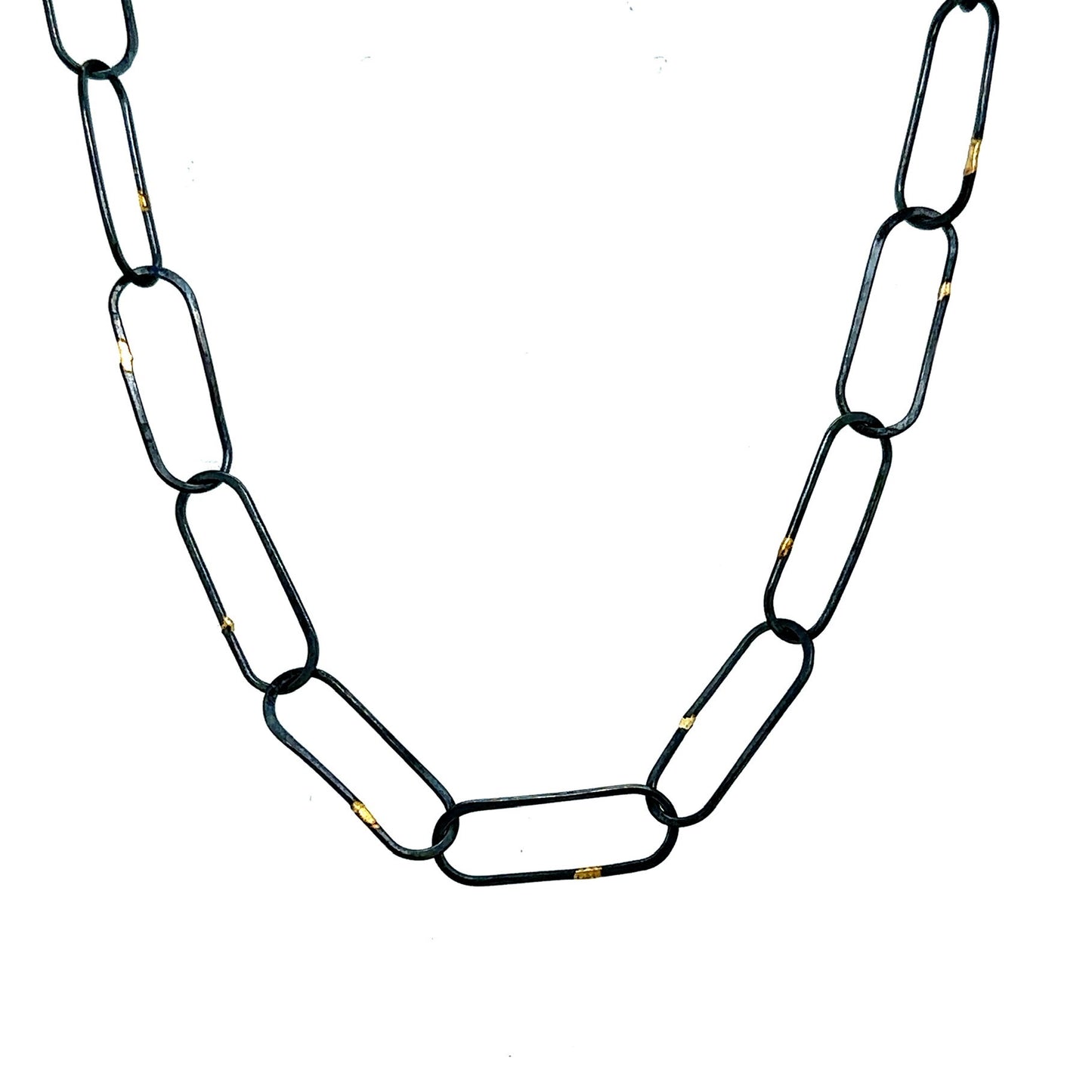 Made in our Seattle Studio, this chain is so refined. Silver links are formed, soldered, oxidized and then accented with 14kt gold. It's uncomplicated and perfect for a few Talisman.