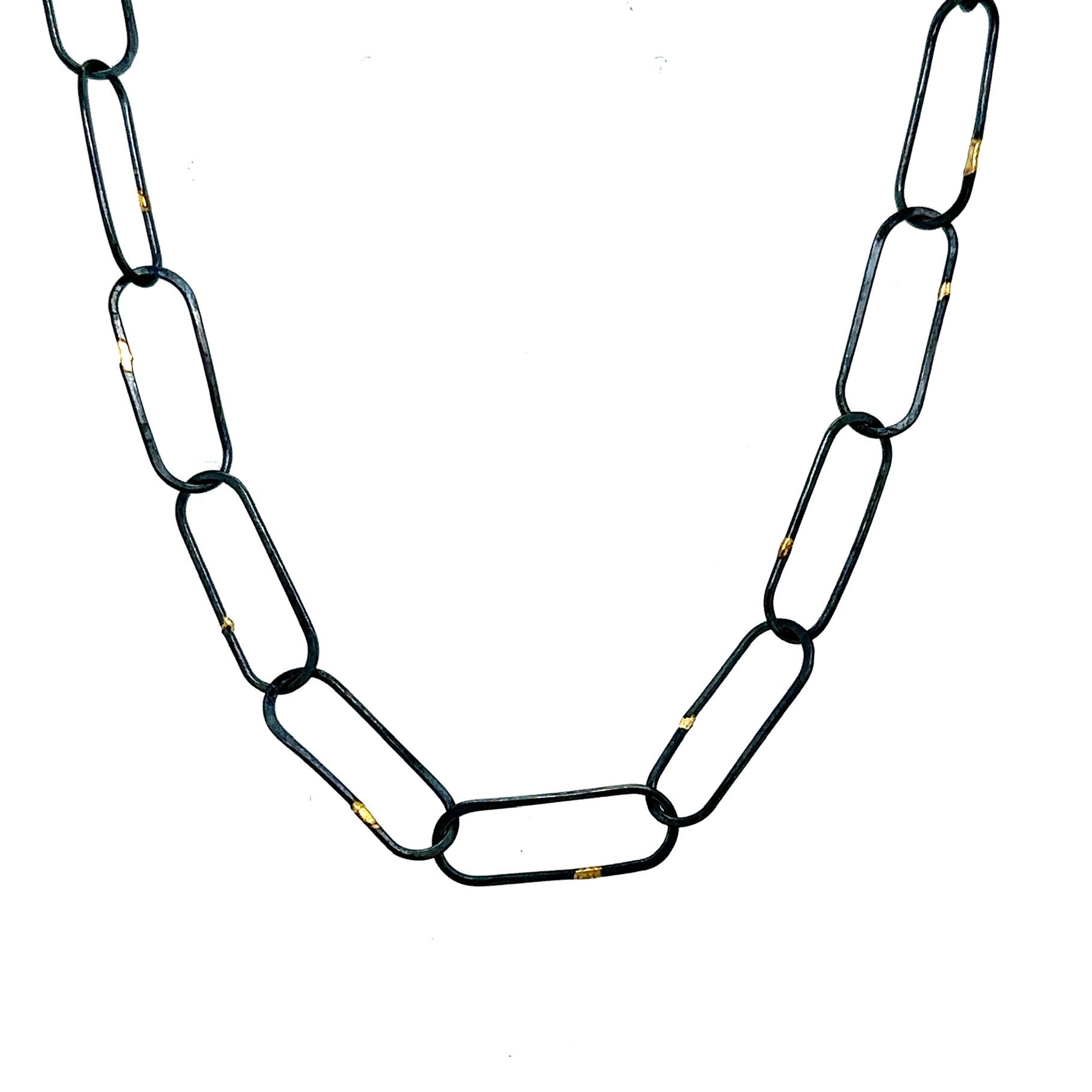 Made in our Seattle Studio, this chain is so refined. Silver links are formed, soldered, oxidized and then accented with 14kt gold. It's uncomplicated and perfect for a few Talisman.