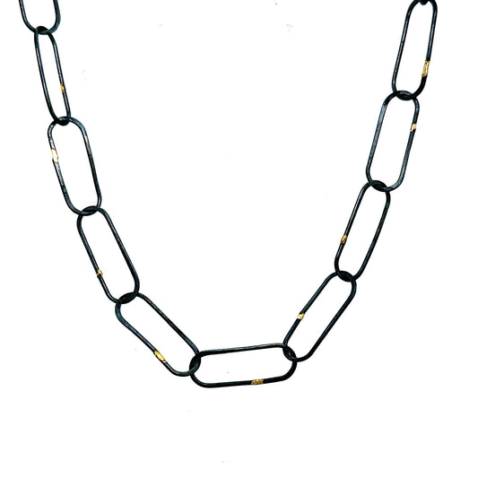 Made in our Seattle Studio, this chain is so refined. Silver links are formed, soldered, oxidized and then accented with 14kt gold. It's uncomplicated and perfect for a few Talisman.