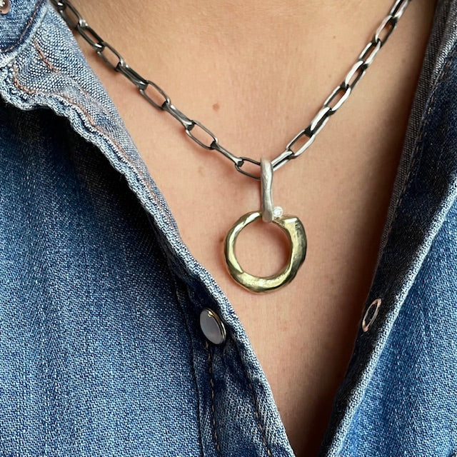 A talisman of transformation, Ascendant embodies the eternal dance between sun and moon, marking the precise moment when change becomes destiny. Two celestial forces intertwine in precious metal, crowned with a radiant 2.5ct white diamond that captures the pure brilliance of personal awakening.