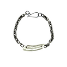 The Pulse Chain Bracelet anchors strength and grace at your wrist. A bold oxidized chain is centered with a hand-sculpted form that is raw, organic, and full of quiet power.