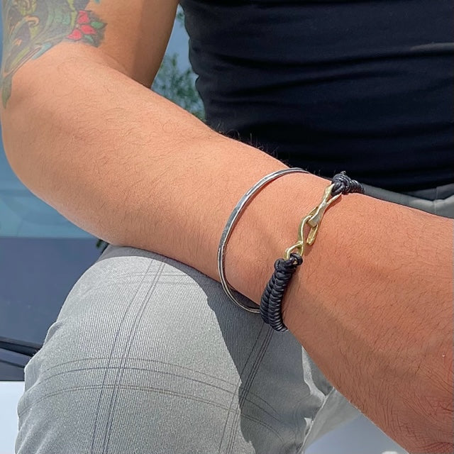 Embrace Oneness and foster a sense of undivided connection with the Unity Cuff. It's a symbol of peace, harmony, and the unifying force that binds us all together. Each is handcrafted in sterling silver and designed for the men in your life! 