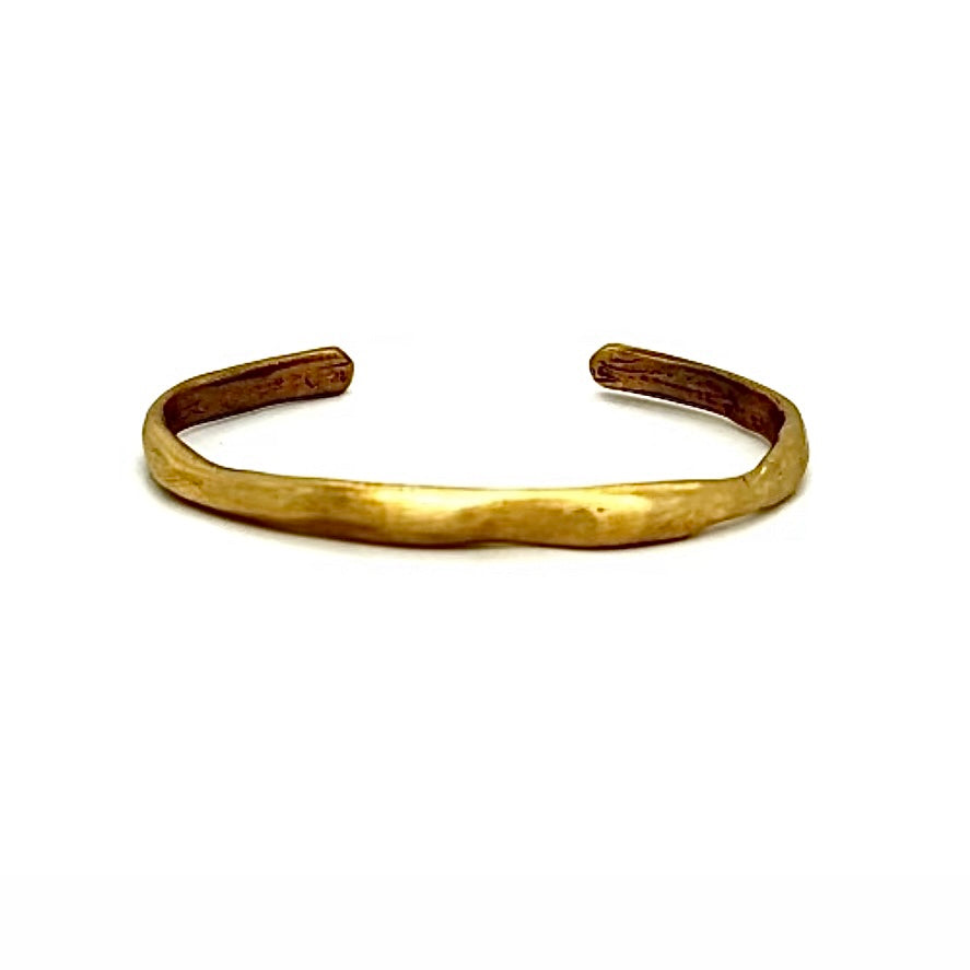 The Divine Cuff effortlessly combines boldness and grace, with its sculptural design and flowing lines. The unparalleled beauty of hand cast bronze embodies quality, artistry and the essence of wabi-sabi design.