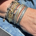 Customer stack of own bracelets with the Tidal Force Cuff