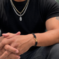 Male model wearing gold link chain with hope talisman pendant layered with curb chain. Also wearing the Interwoven Bracelet with Bronze Clasp.